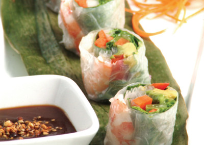 Four sections of our cold shrimp roll with asian dipping sauce.