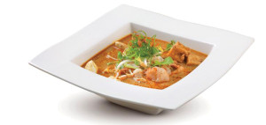 White square bowl of Thai Red Curry with shrimp.