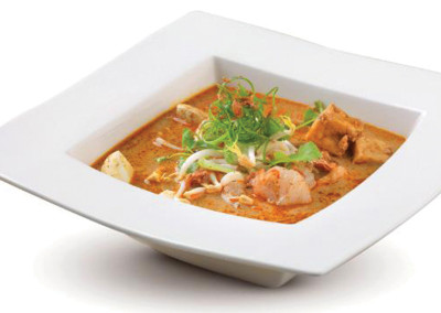 White square bowl of Thai Red Curry with shrimp.