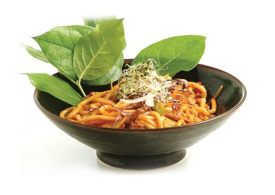 Dark green bowl filled with classic Shanghai Noodles.